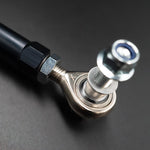 Suspension Secrets front drop link, close-up of the rose joint, stud and nyloc nut on a dark background - Suspension Secrets Thumbnail
