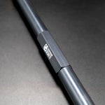 Suspension Secrets drop link, close-up of the engraved logo on a dark grey hex section - Suspension Secrets Thumbnail