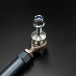 Suspension Secrets front drop link, rod end, lock nut and stud on a dark background - Suspension Secrets Thumbnail