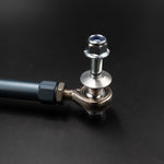 Suspension Secrets front drop link rod end, stud and lock nut on a black background - Suspension Secrets Thumbnail
