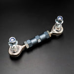 Suspension Secrets rear drop link from above, showing the hex body and rod ends on black - Suspension Secrets Thumbnail