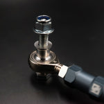 Suspension Secrets rear drop link rod end, spacer and nylon lock nut on black - Suspension Secrets Thumbnail
