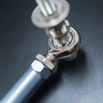 Suspension Secrets grey tie rod end, close-up from above of the rod end and lock nut - Suspension Secrets Thumbnail