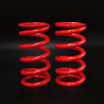 Suspension Secrets uprated spring package, pair of red main springs on a dark background - Suspension Secrets Thumbnail