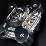 Suspension Secrets camber plate, close-up of the spherical bearing, centre nut and toothed adjuster slot - Suspension Secrets Thumbnail
