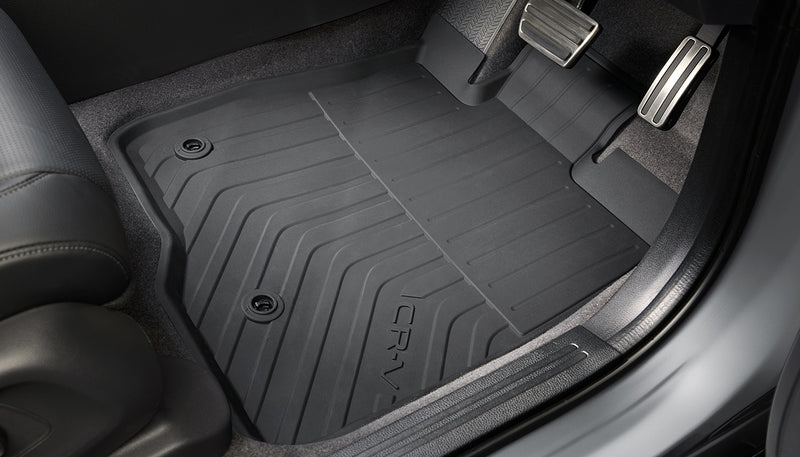 Black Honda Access all-season mat with CR-V logo in the driver's footwell of a Honda CR-V RS - Honda - Genuine