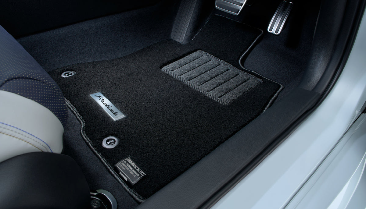 Black Honda Access premium floor mat with heel pad in the driver's footwell of a Prelude BF1
