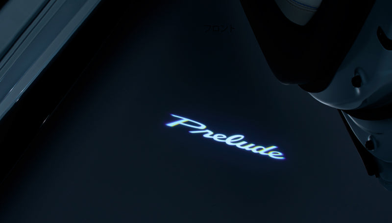 Prelude logo projected in white light onto the ground beside an open Honda Prelude BF1 door - Honda - Genuine