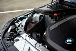 MST heat shield and red filter fitted next to the B58 engine in a BMW G-series, wider view - MST Performance Thumbnail
