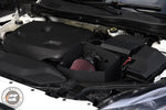 MST intake with red filter installed in a white Volvo V40 engine bay, cover off - MST Performance Thumbnail