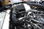 MST black silicone turbo inlet pipe installed between the factory airbox and B48 turbo in a BMW G20 - MST Performance Thumbnail