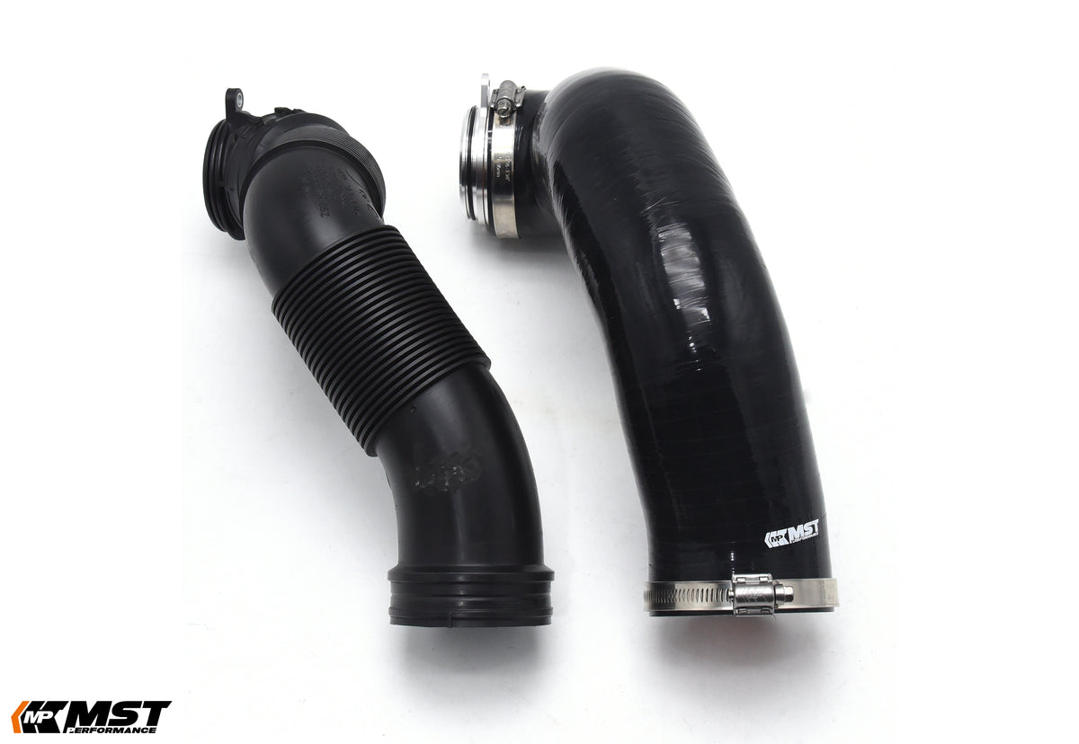 MST silicone turbo inlet hose next to the factory ribbed inlet tube