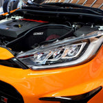 MST intake heat shield and red filter behind the headlight of an orange Toyota GR Yaris - MST Performance Thumbnail