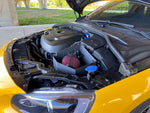 MST cold air intake filter and airbox installed next to the Drive-E engine in a yellow Volvo - MST Performance Thumbnail