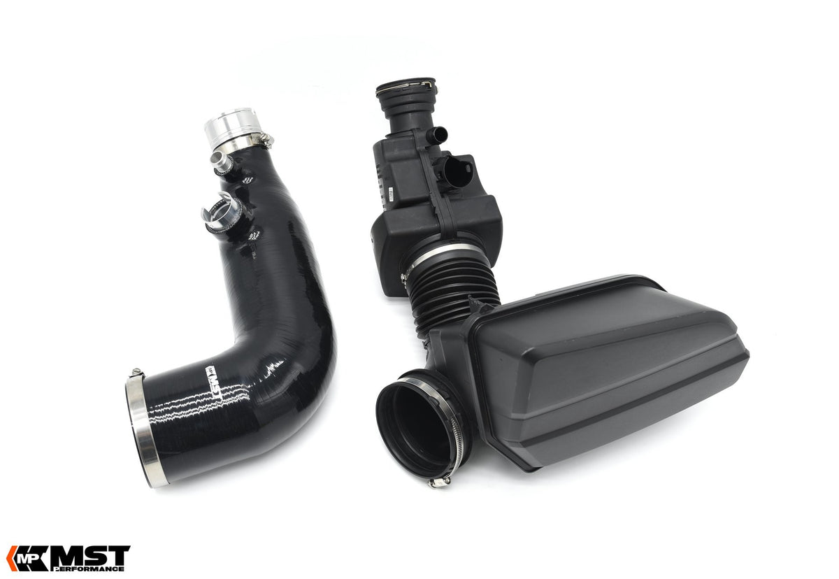MST silicone turbo inlet pipe beside the factory BMW B48 airbox and plastic inlet pipe