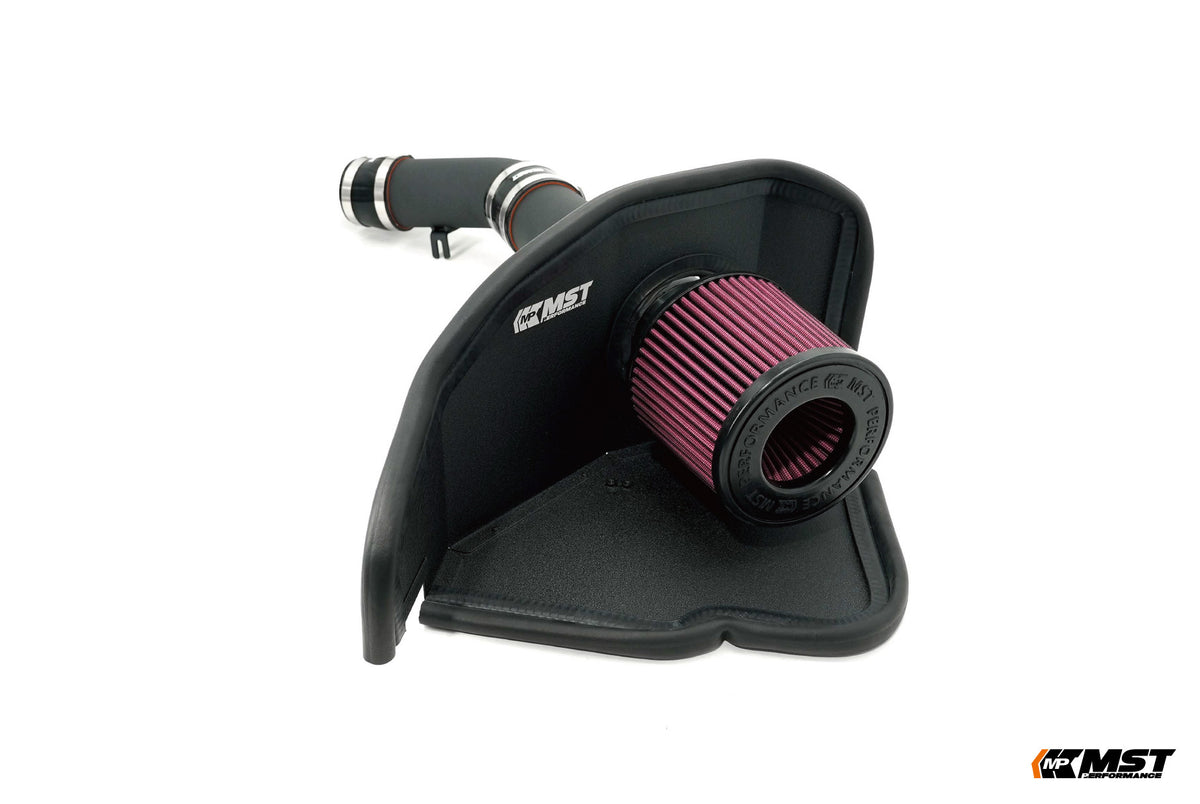 MST Toyota GR Corolla cold air intake: red cone filter in a black moulded heat shield with black intake pipe