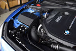 MST heat shield cover and black intake tube fitted in a blue BMW F-series B58 engine bay - MST Performance Thumbnail