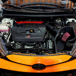 Orange Toyota GR Yaris engine bay with the MST cold air intake installed, front view - MST Performance Thumbnail