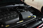 MST cold air intake and silicone pipe fitted in a VW Golf GTI Mk8 engine bay, side view - MST Performance Thumbnail