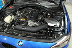 BMW N55 engine bay with the MST intake pipe and heat shield installed, front view - MST Performance Thumbnail