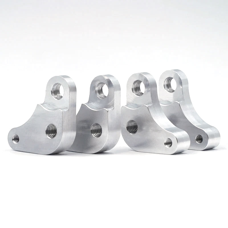 Suspension Secrets seat raisers, set of four machined aluminium brackets in a row - Suspension Secrets