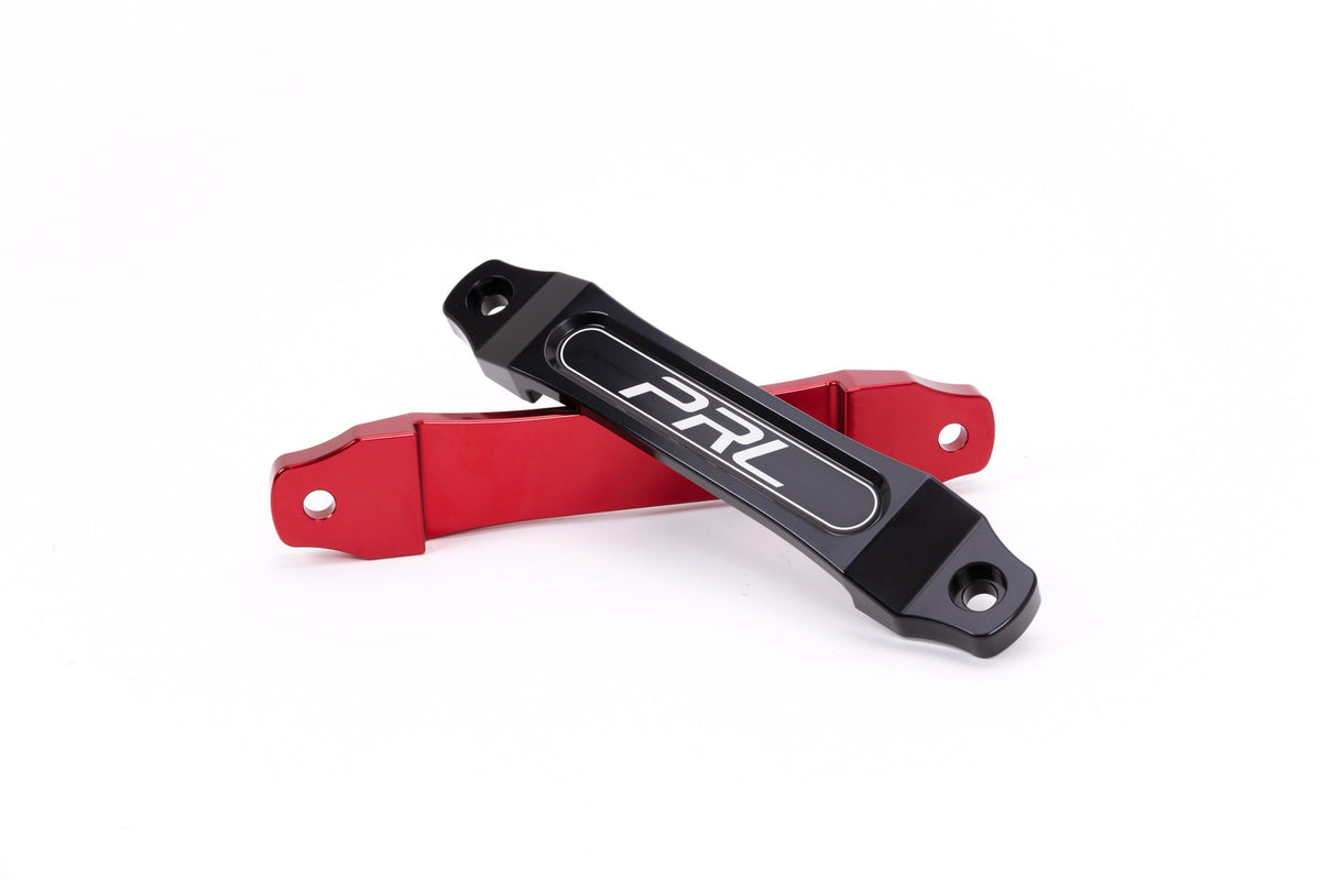 PRL V3 billet battery tie downs in red and black