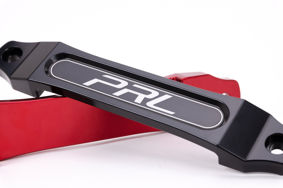 PRL billet battery tie down - black and red close-up of the PRL logo