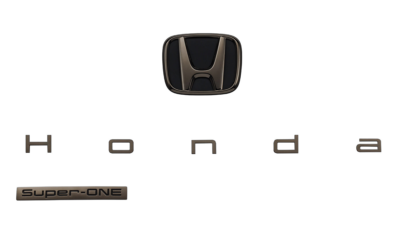 Honda Access black chrome emblem on the Honda Super-ONE